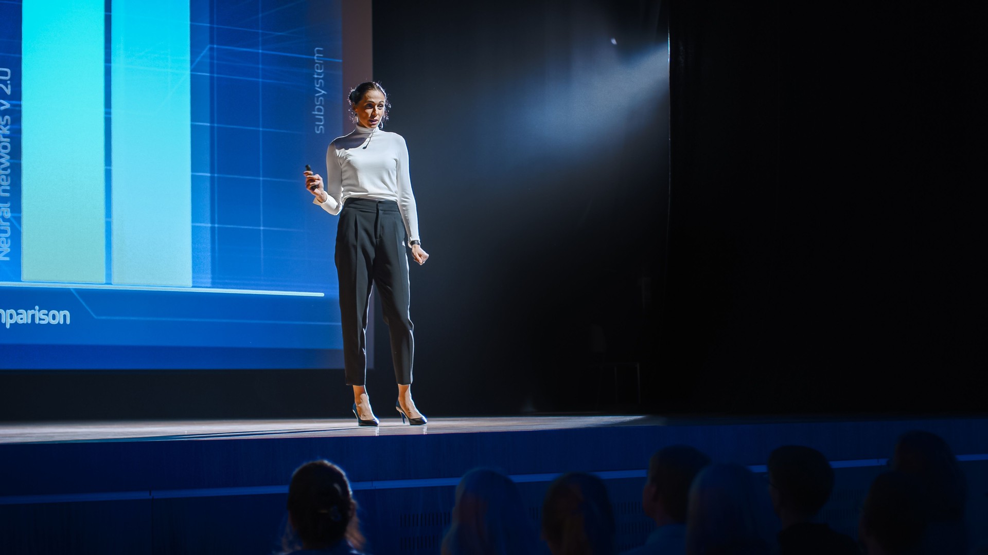 Tech Conference Stage: Visionary Female Speaker Talks about Product. Neural Networks, Artificial Intelligence, Big Data and Machine Learning. Infographics On Big Screen. Live Startup Business Event